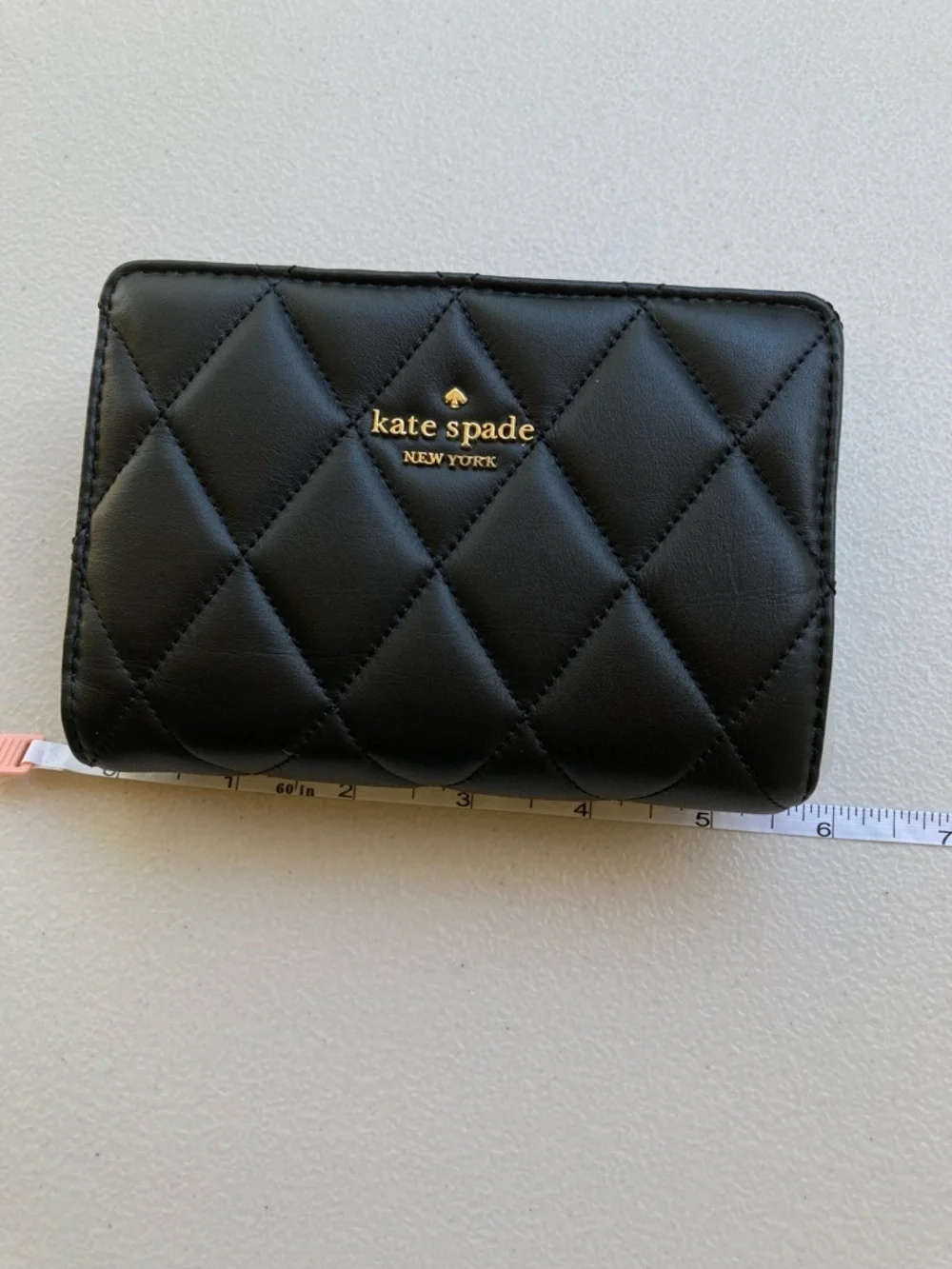 Kate Spade New York Carey Medium Compact Bifold Wallet in Black Quilted Leather